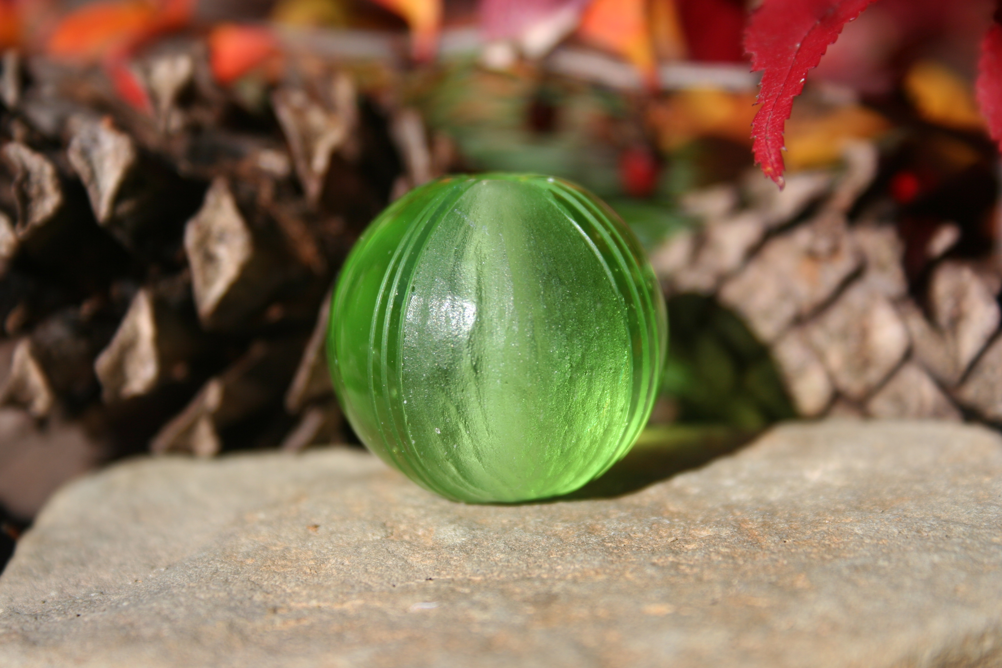 green carved glass bead-
