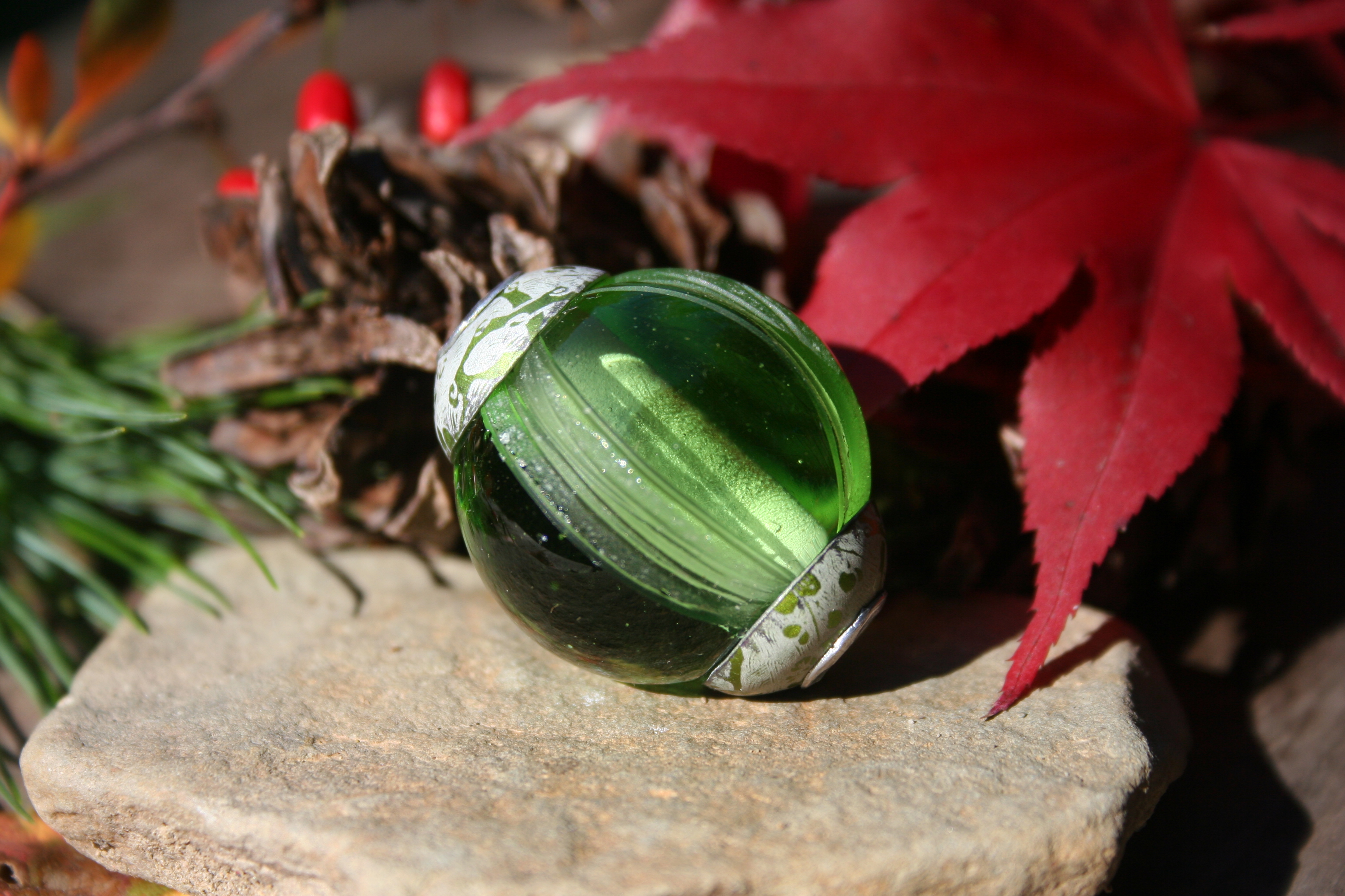 glass bead-deep green cored and capped bead-